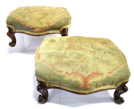 A PAIR OF 19TH CENTURY FOOTSTOOLS  with tapestry tops and cabriole legs, each 15cm high, 34cm wide, 30cm deep.