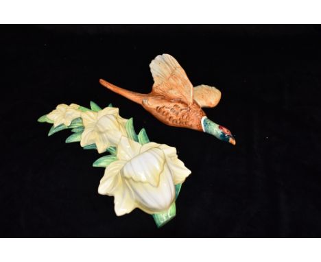 A CARLTONWARE WALL PLAQUE modelled as three graduated daffodils, 30cm high; and a Beswick pheasant wall plaque model 661/1, 3