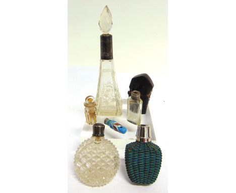 SIX ASSORTED SCENT BOTTLES  including one in a tortoiseshell case, the largest 15cm high inclusive of stopper. Condition Repo