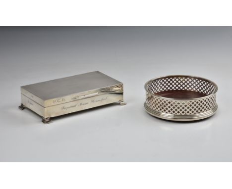 A modern silver wine coaster, W I Broadway &amp; Co., Birm. 1991, with pierced lattice sides and turned mahogany base, 5in. (