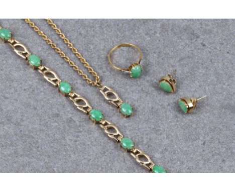 An 18ct gold, jade and diamond ring, the light, mottled apple green jade cabochon flanked by diamond set shoulders, size M½; 