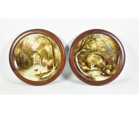 A pair of Copeland Spode Chargers in wooden circular frames, probably concealing marks and titles on reverse, both signed low