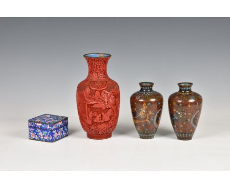 A Chinese cinnabar lacquer vase, early 20th century, baluster form, carved with figures and buildings in wooded mountain land