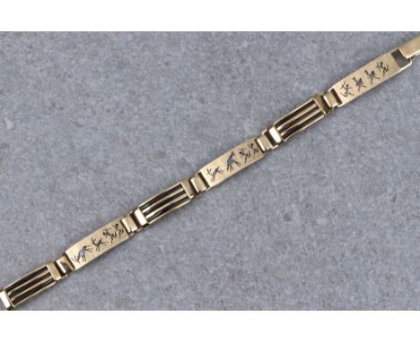 An African 9ct gold and elephant hair articulated bracelet, with alternate links of deeply etched African hunting scenes on b