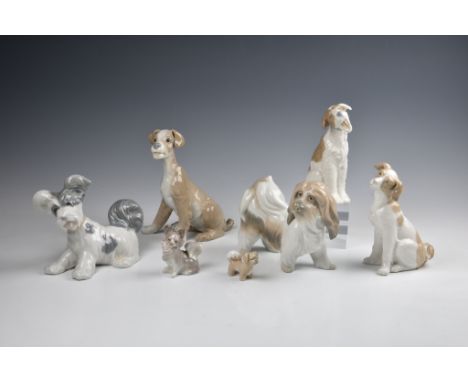 Seven figures of dogs by Lladro and Nao, including three large figures by Lladro, two slightly smaller by Nao; and two miniat