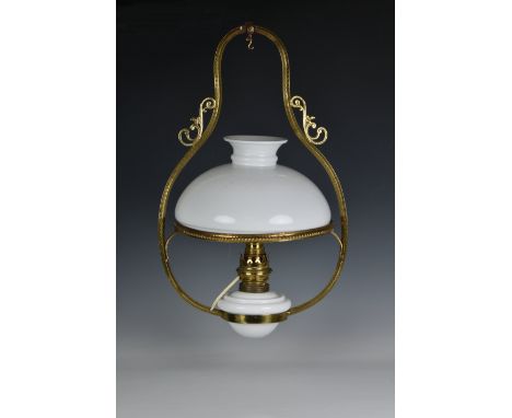A 19th century style brass ceiling oil lamp, 20th century, fitted for electricity, with white milk glass reservoir and shade,