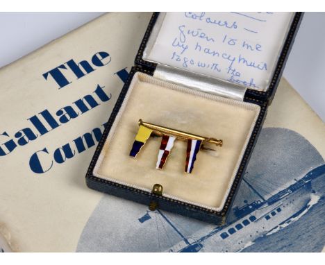 A boxed 18ct Gold Brooch in the form of a pole with three enamel pennants, stamped 'Benzie Cowes', inscribed in the box 'By K