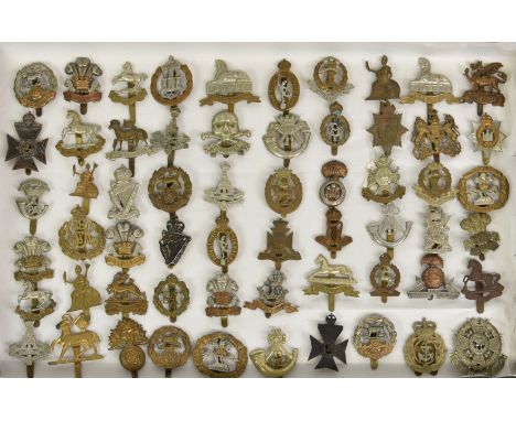 A large collection of approximately seventy five (75) various Military cap badges, to include Officer Training Corps OTC Lond