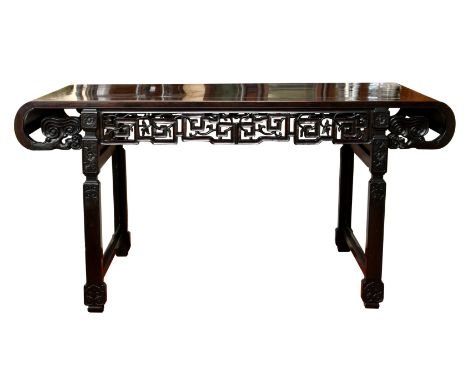 A large 19th century Chinese dark hardwood altar table, probably zitan, the rectangular cleated top with single floating pane