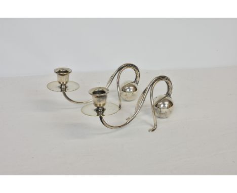 A pair of German Jugenstil silver plated candlesticks, designed by Carl Deffner (1856-1948), 9¼in. (23.5cm.) long, 4¼in. (10.
