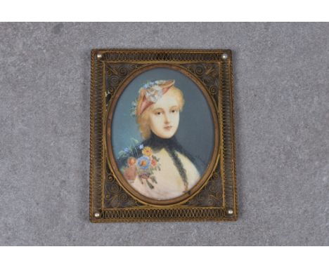 Continental School, mid 19th century, Oval Portrait Miniature of a Young Woman in a Hat, signed indistinctly above the left s
