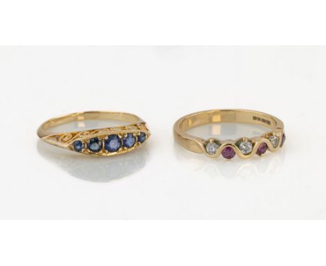 Two 9ct yellow gold rings, comprising a Victorian style five stone sapphire ring with scroll carved sides, size M½; and a rub