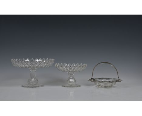 A graduated pair of late Georgian glass tazzas, each shallow bowl cut with interlaced pointed leaves and an upturned, barbed 