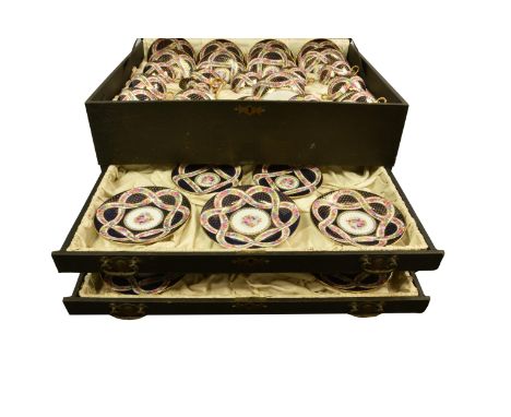 A cased Bohemian porcelain dessert or luncheon service, for twelve settings, each piece centred by a bouquet of flowers on wh