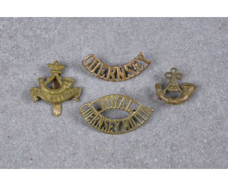 A Guernsey Militia shoulder title, the word 'Royal' above 'Guernsey Militia' in elliptical form, together with a cap badge wi