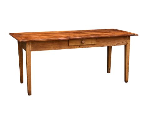 A 19th century French beech and elm farmhouse table, the cleated, three plank top over a deep frieze with single drawer, rais