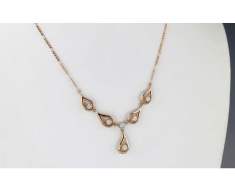 A 9ct gold and opal necklace, hallmarked London 1992, the necklace with four teardrop links and a fifth suspended beneath, ea