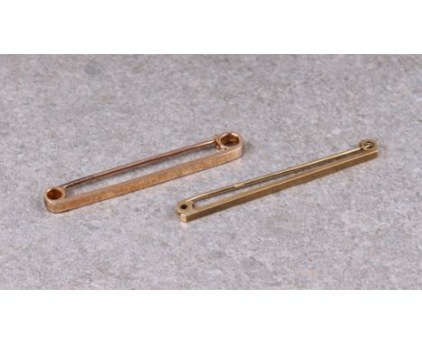Two 9ct gold bar tie pins, 2in. (5.1cm.) long. (2). * 