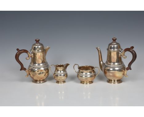 An Elizabeth II silver four piece coffee set, Charles S Green &amp; Co Ltd, Birmingham, 1957/59, baluster form with decorativ