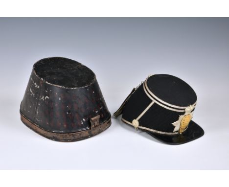 An extremely rare 2nd Royal Guernsey Militia shako, black cloth sides and top, having diagonal stripes with silver trim, pate