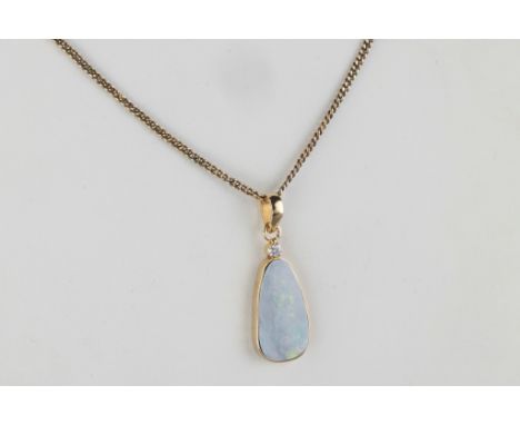 An 18ct gold, opal and diamond pendant on chain, the ovoid, cabochon opal, approx. 20 x 10.5mm., headed by a single, brillian