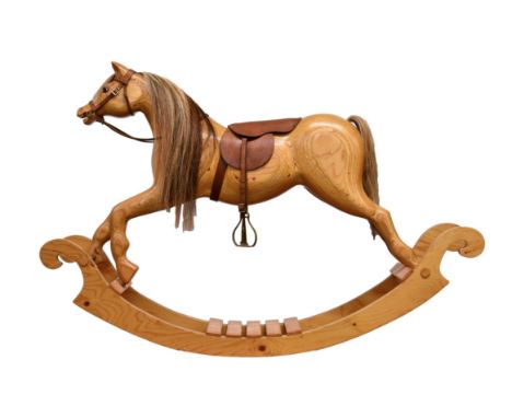 A contemporary laminated plywood rocking horse, bow type, with real horse hair mane etc, leather saddle and rains, 60in. (153