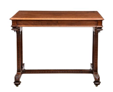 A Victorian walnut centre table by Gillows, stamped 'Gillow' to drawer, the chamfered edged rectangular top with clipped corn