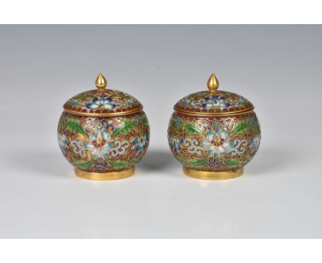 A pair of miniature Chinese gilt metal champleve enamel covered jars, 20th century, of globular form, the domed covers with t