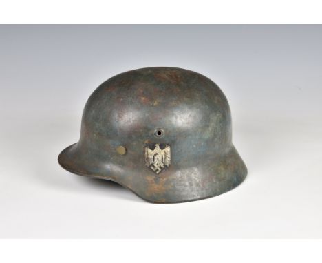 A WWII German Army (Heer) M-35 Double Decal steel combat helmet, greyish-blue, original army silver blacklined Wehrmacht eagl