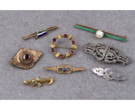 A small group of antique and vintage brooches, including a 9ct gold, peridot and seed pearl shamrock brooch; a 9ct gold, amet