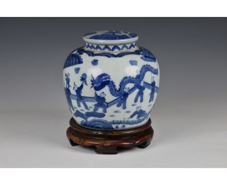 A Chinese blue and white porcelain ginger jar, 20th century, oainted with a parade of children in a fenced garden, some beari