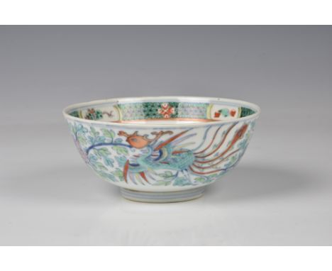 A Chinese porcelain doucai phoenix bowl, four character seal mark, probably 19th century, with rounded sides supported on a s