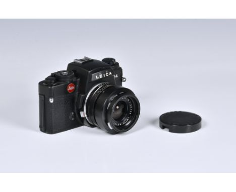 A Leica R4 SLR Camera, serial No. 1601467,with Leitz Wetzlar Elmarit-R 1:2.8/35 Lens, serial No. 2034567.  we are not experts