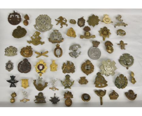A large collection of approximately one hundred &amp; thirty (130) various Military cap badges / patches etc, to include Ardi