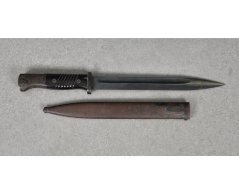 A Second War German Mauser K98 bayonet with blackened blade, with metal scabbard, numbers not matching.  Makers and numbers n