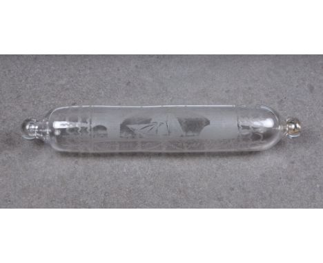 A rare clear glass rolling pin, well engraved with a sailing ship passing under an iron bridge, 'span 236 feet, height 100 fe