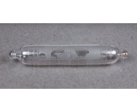 A rare clear glass rolling pin, well engraved with a sailing ship passing under an iron bridge, 'span 236 feet, height 100 fe