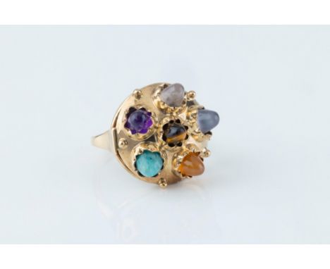 A mid-century Indian-style 14ct gold and multi gem ring, hallmarked '585', the domed ring set with six crimp-set ovoid caboch