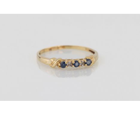 A 10ct yellow gold, sapphire and diamond five stone ring, the three round cut sapphires spaced with two single cut diamonds, 