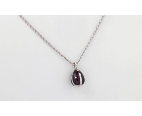 A Victor Mayer for Faberge 18ct white gold and enamel egg pendant, the pendant decorated with four panels of chestnut enamel,