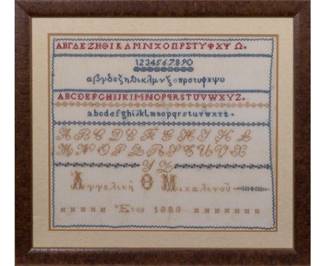 A late 19th century Greek alphabet sampler, inscribed and dated 1888, with panels of Greek and Latin alphabet script, within 