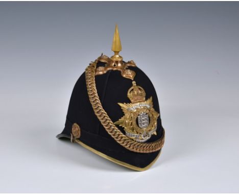 A 1st Royal Guernsey Militia Victorian Officer's black cloth Helmet, the black cloth covered skull with gilt fittings includi