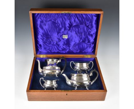 An oak cased George V silver four piece tea and coffee service, Joseph Rodgers &amp; Sons, Sheffield 1917, comprising teapot,