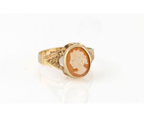 A 9ct gold and shell cameo ring, hallmarked Birm. 1978, carved with a portrait of a maiden, over bright cut shoulders, size N