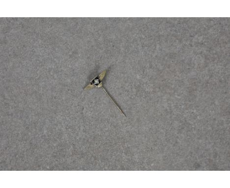 A German WWII S A Reserve stickpin, enamel swastika between wings on the knurled pin, the reverse is marked “Ges. Gesch.”, 1 