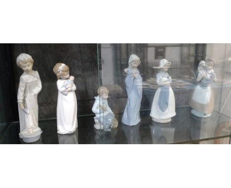 Five Nao figures of girls 24cm to 28cm and a seated boy with a rabbit 15cm (6) 