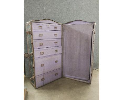 An early 20th Century Innovation metal bound fitted travel trunk 