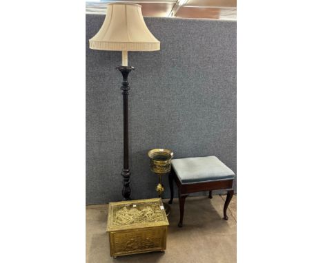 A carved oak standard lamp, a brass ice bucket, brass log bin and piano stool