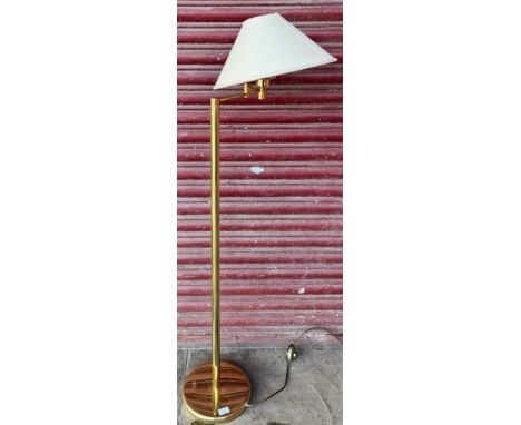 An articulated brass standard lamp 