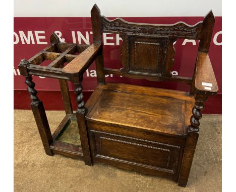 An early 20th Century carved oak hall seat/stick stand 